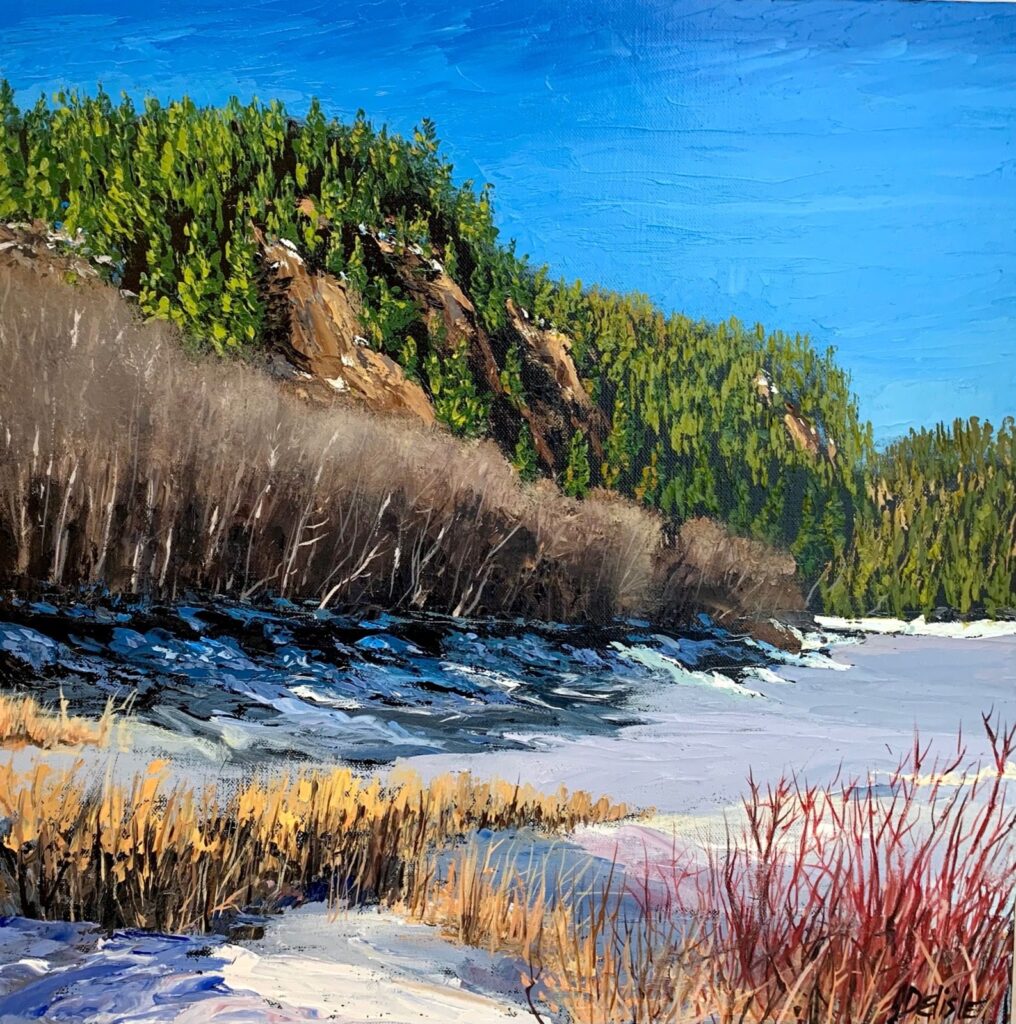 Près de la rivière Valin, huile de Jean Delisle : la rivière Valin au printemps, neige sur la berge, herbes dorées et falaise boisée
